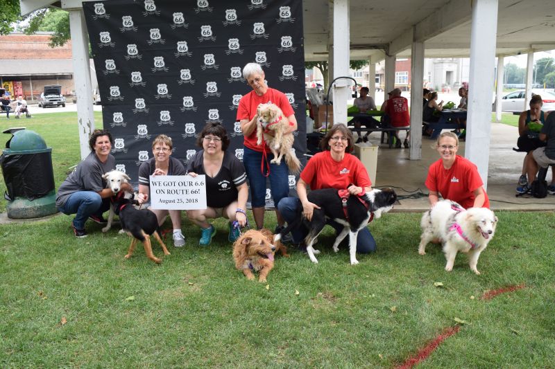 Ruby's Rescue & Retreat Crew in front of the custom backdrop